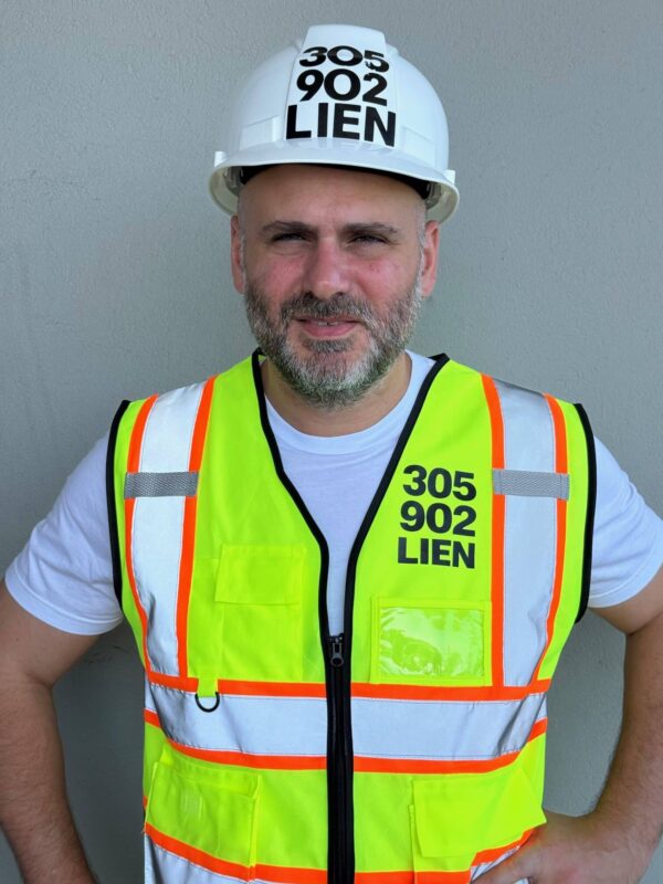 Armando Montesino wearing his 305-902-LIEN hardhat and safety vest